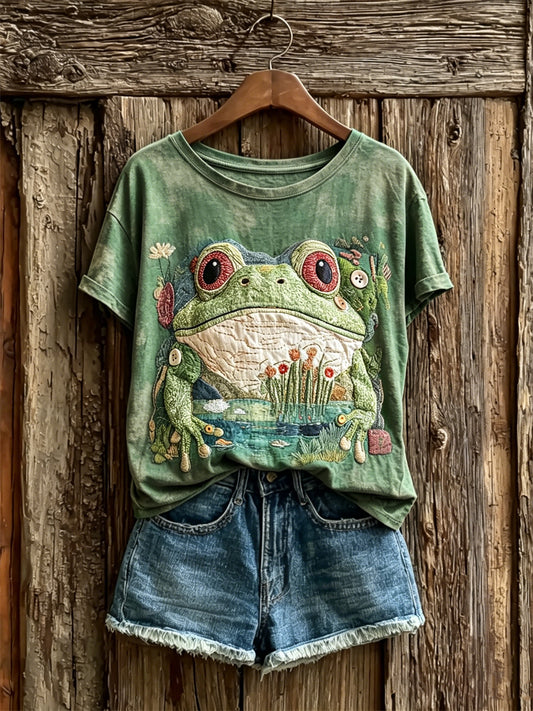 Damen-T-Shirt mit kunstvoller Druckmotiv-Optik: niedlicher Frosch und Teichszene, kurzärmelig